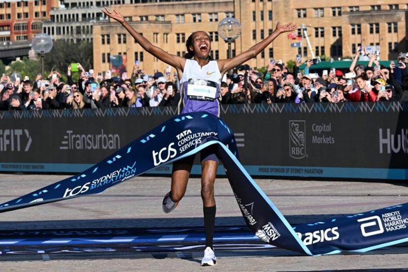 Netherlands's Sifan Hassan crosses the finish line first in the 2025 Sydney Marathon, crossing the iconic Harbour Bridge on August 31, 2025.  Saeed KHAN / AFP