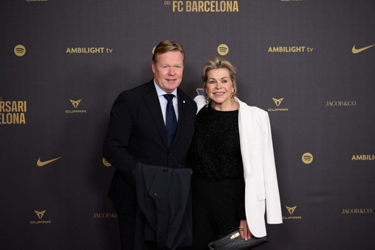 Former Barcelona player and coach Ronald Koeman (L) and his wife Bartina arrive to attend a gala in celebration of the 125th anniversary of the founding of FC Barcelona, in the Gran Teatre del Liceu theatre in Barcelona on November 29, 2024.  Josep LAGO / AFP