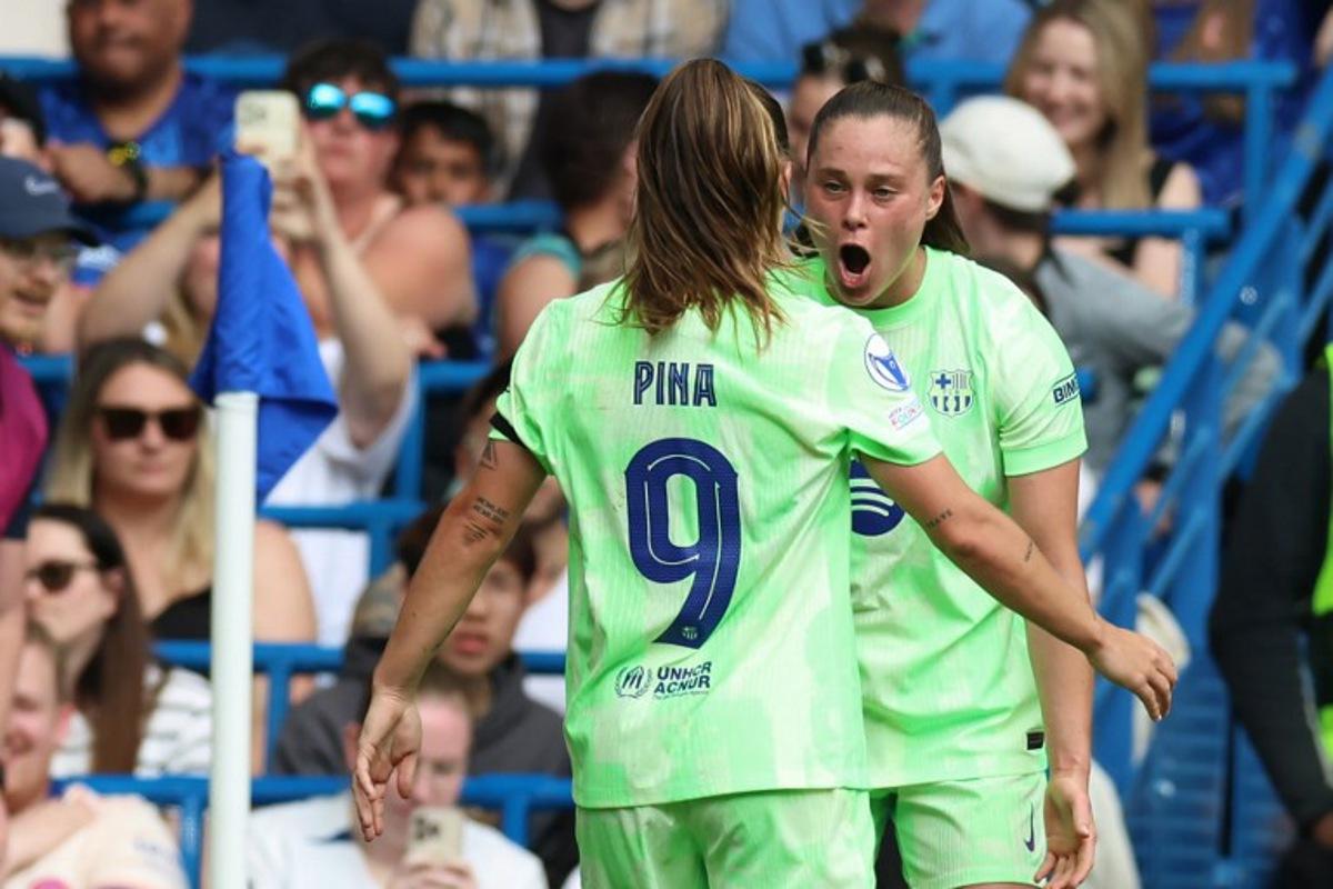 Barcelona's Polish striker #17 Ewa Pajor (R) celebrates with Barcelona's Spanish striker #09 Claudia Pina (L) after scoring their second goal during the UEFA Women's Champions League league semi-final second leg football match between Chelsea and Barcelona at Stamford Bridge in London on April 27, 2025.  Darren Staples / AFP