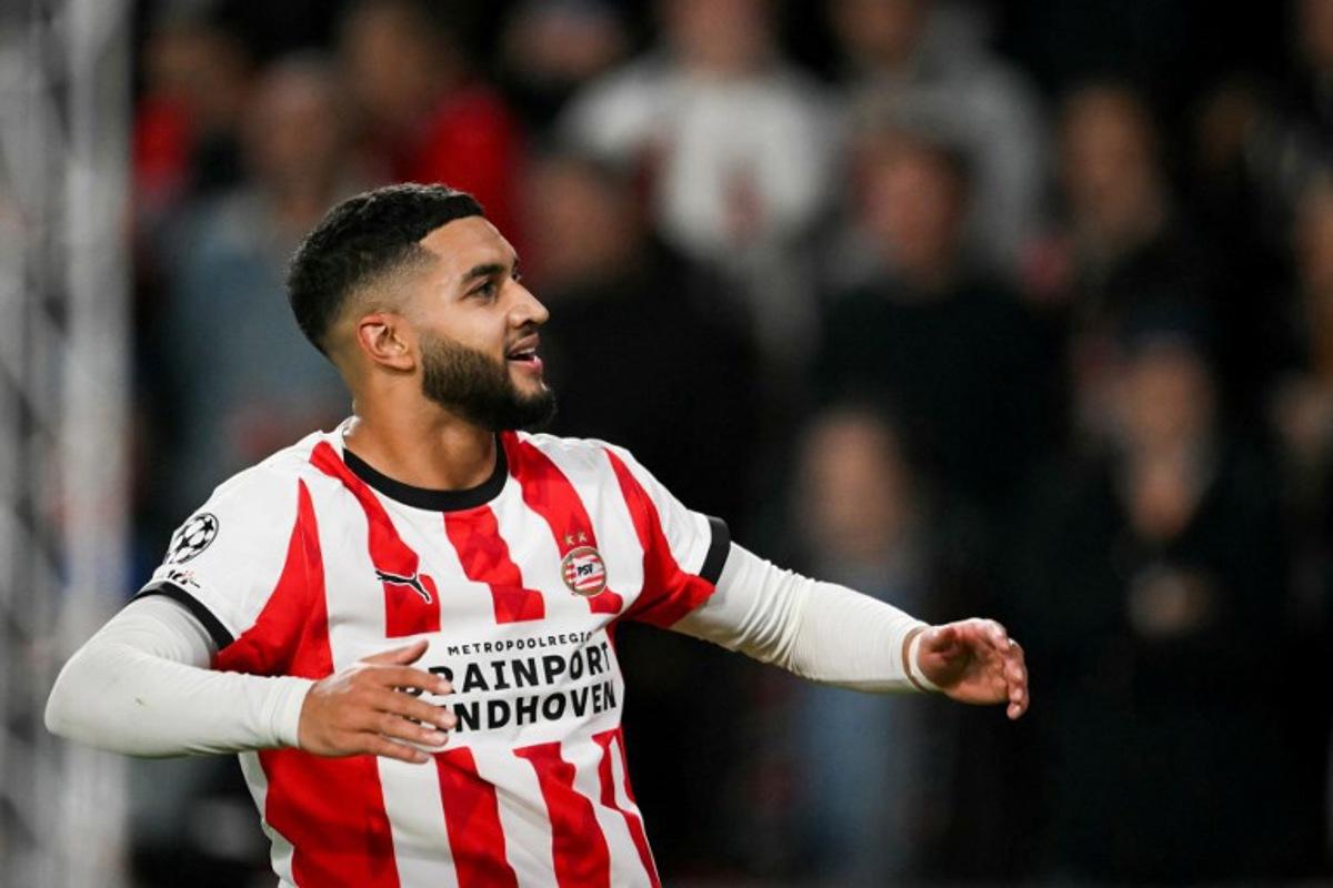 PSV Eindhoven's Moroccan midfielder #34 Ismael Saibari celebrates after scoring his team second goal during the UEFA Champions League, league phase football match between PSV Eindhoven and Napoli at the Philips Stadium, in Eindhoven, on October 21, 2025.  NICOLAS TUCAT / AFP