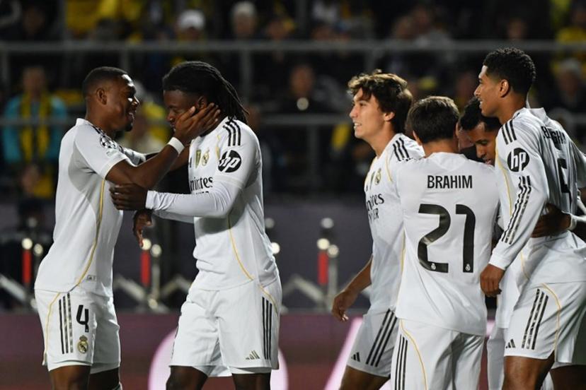 Real Madrid's French midfielder #06 Eduardo Camavinga (2nd L) celebrates scoring his team's fourth goal with his teammates during the UEFA Champions League first round day 2 football match between Kairat Almaty and Real Madrid at the Almaty Ortalyk stadion in Almaty on September 30, 2025.  Vyacheslav OSELEDKO / AFP