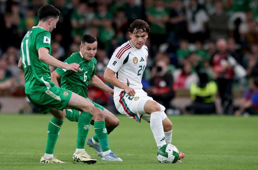 Republic of Ireland's midfielder #11 Finn Azaz battles for the ball with Hungary's midfielder #21 Alex Toth during the 2026 World Cup Group F qualifier football match between Republic of Ireland and Hungary, at Aviva Stadium, in Dublin, on September 6, 2025.   Paul Faith / AFP