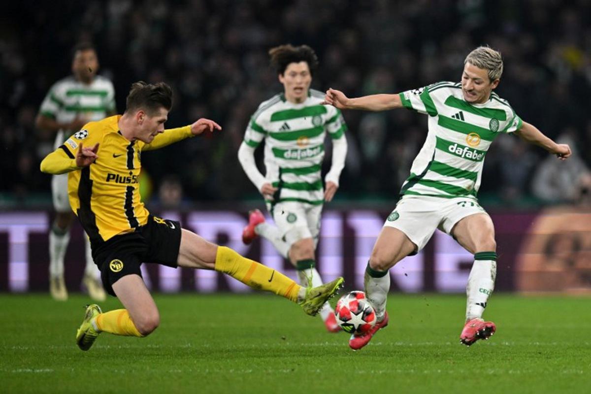 Young Boys' Polish midfielder #08 Lukasz Lakomy battles for the ball with Celtic's Japanese striker #38 Daizen Maeda during the UEFA Champions League football match between Celtic and Young Boys at Celtic Park stadium in Glasgow, Scotland on January 22, 2025.   ANDY BUCHANAN / AFP