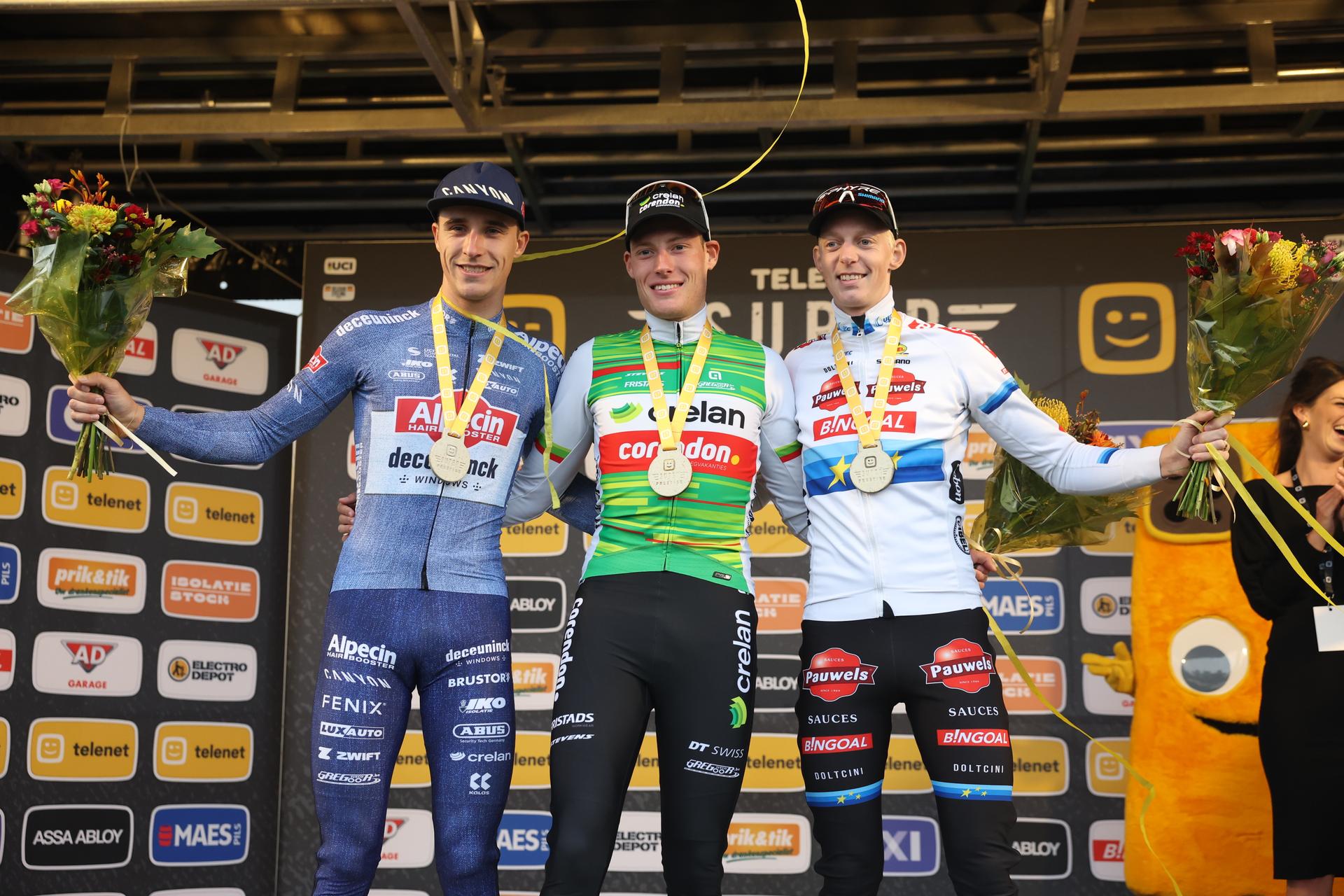 Belgian Niels Vandeputte, Belgian Joran Wyseure and Belgian Michael Vanthourenhout celebrate on the podium after the men elite race of the Cyclocross Ruddervoorde, Sunday 20 October 2024 in Oostkamp, the first stage of the Superprestige cyclocross cycling competition. BELGA PHOTO KURT DESPLENTER