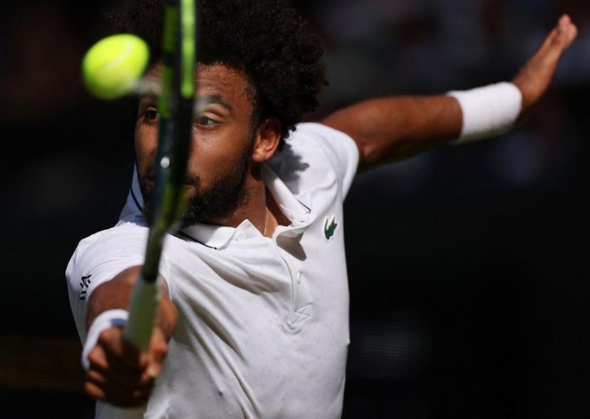 France's Arthur Fils returns against Italy's Matteo Berrettini during their men's singles second round tennis match on the fourth day of the 2026 Wimbledon Championships at The All England Lawn Tennis and Croquet Club in Wimbledon, southwest London, on July 2, 2026.  Adrian Dennis / AFP