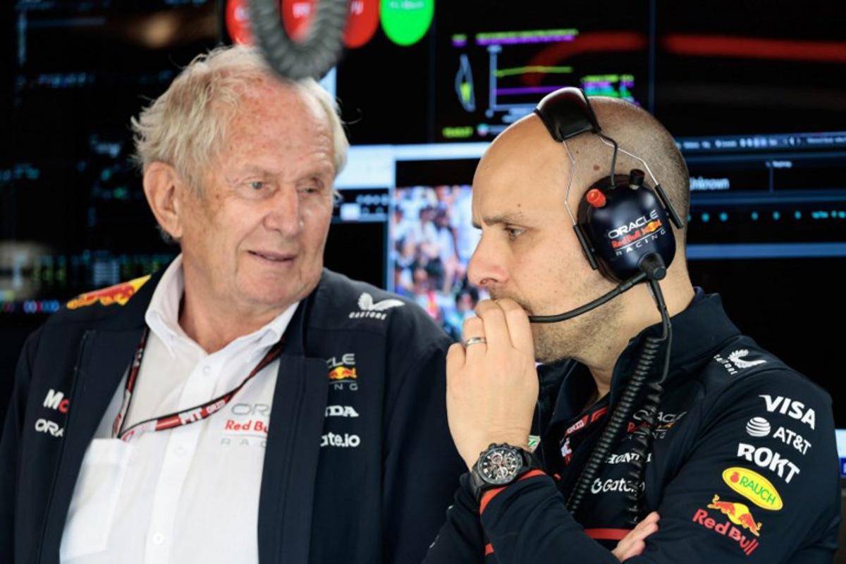 (L/R) Oracle Red Bull Racing special advisor Helmut Markro and Oracle Red Bull Racing engineer Gianpiero Lambiase speak with each other during the qualifying session for the 2025 Formula 1 Grand Prix du Canada at Circuit Gilles-Villeneuve in Montreal, Canada, on June 14, 2025.   SHAWN THEW / POOL / AFP