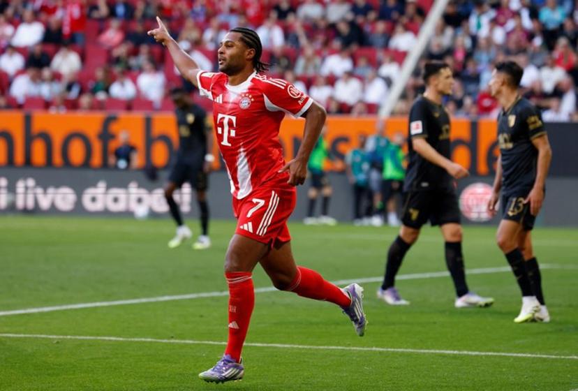 Bayern Munich's German forward #07 Serge Gnabry celebrates scoring the opening goal during the German first division Bundesliga football match between FC Augsburg and FC Bayern Munich in Augsburg, southern Germany, on August 30, 2025.  Michaela STACHE / AFP