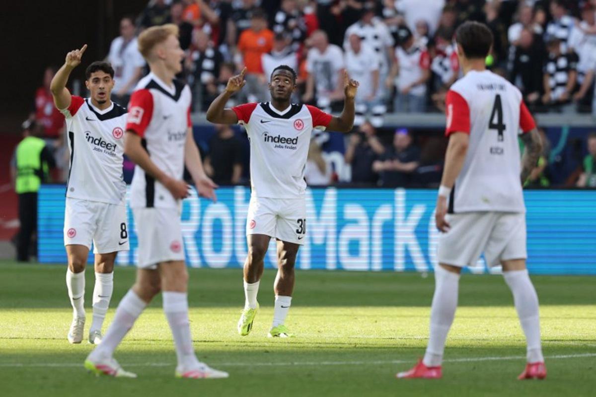 Frankfurt's Belgian forward #30 Michy Batshuayi (2nd R) celebrates scoring the 2-2 goal with his teammates during the German first division Bundesliga football match between Eintracht Frankfurt and FC St. Pauli in Frankfurt, western Germany, on May 11, 2025.  Daniel ROLAND / AFP