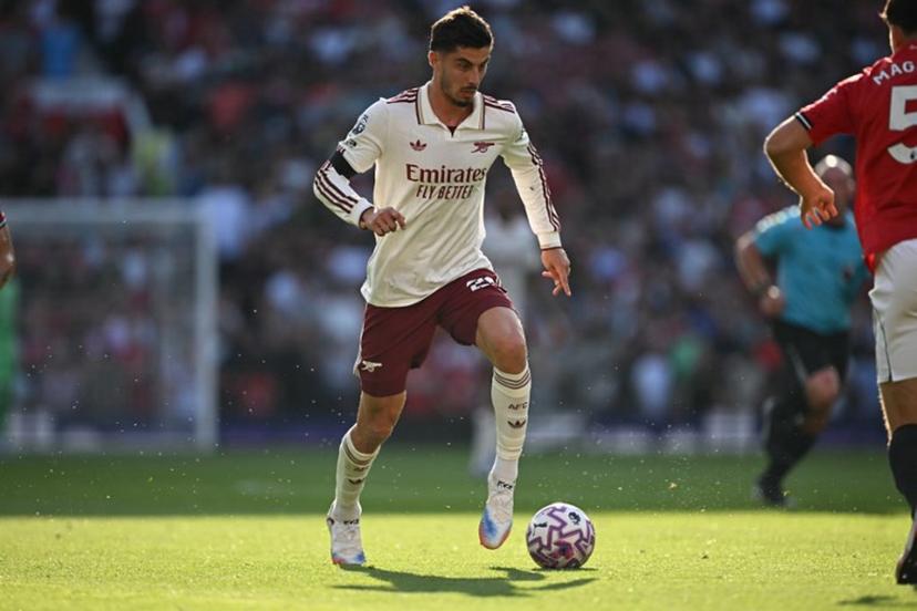 Arsenal's German midfielder #29 Kai Havertz runs with the ball during the English Premier League football match between Manchester United and Arsenal at Old Trafford in Manchester, north west England, on August 17, 2025.  Paul ELLIS / AFP