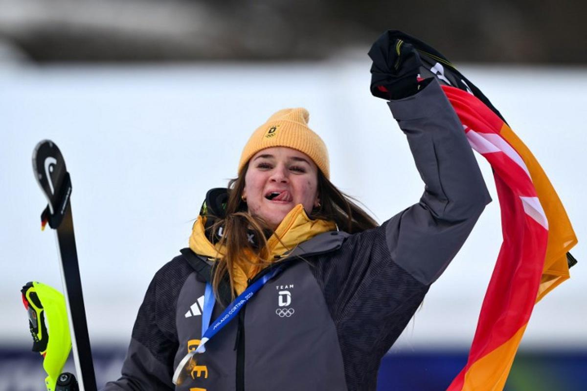 Silver medallist Germany's Emma Aicher celebrates after the women's team combined event during the Milano Cortina 2026 Winter Olympic Games at the Tofane Alpine Skiing Centre in Cortina d'Ampezzo on February 10, 2026.  Marco BERTORELLO / AFP
