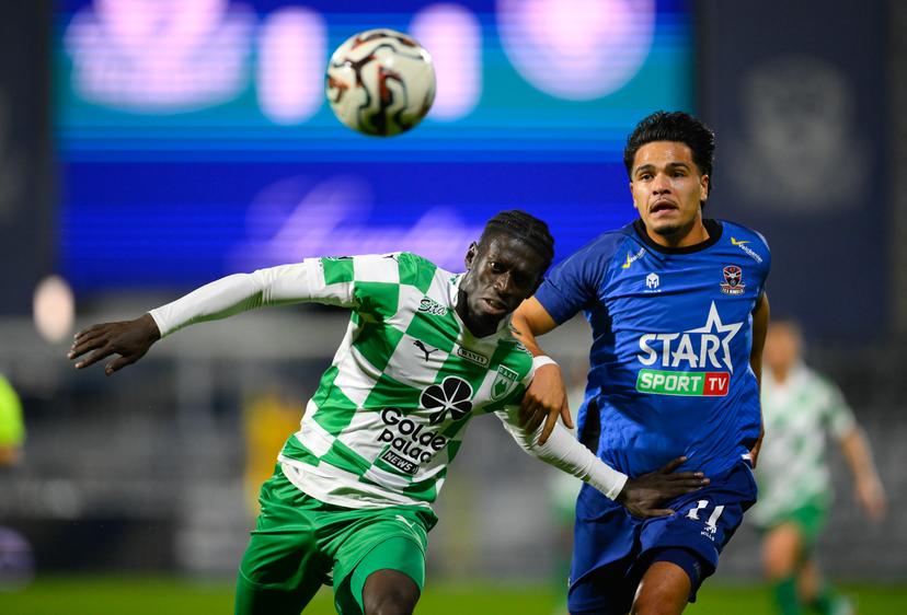 Dender's Ragnar Oratmangoen and RAAL's Wagane Faye fight for the ball during a soccer match between FCV Dender EH and RAAL La Louviere, Sunday 28 September 2025 in Denderleeuw, on day 9 of the 2025-2026 'Jupiler Pro League' first division of the Belgian championship. BELGA PHOTO JOHN THYS