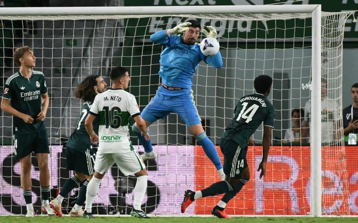 Real Madrid's Belgian goalkeeper #01 Thibaut Courtois makes a save during the Spanish league football match between Elche CF and Real Madrid CF at Martinez Valero Stadium in Elche on September 15, 2026.  JOSE JORDAN / AFP