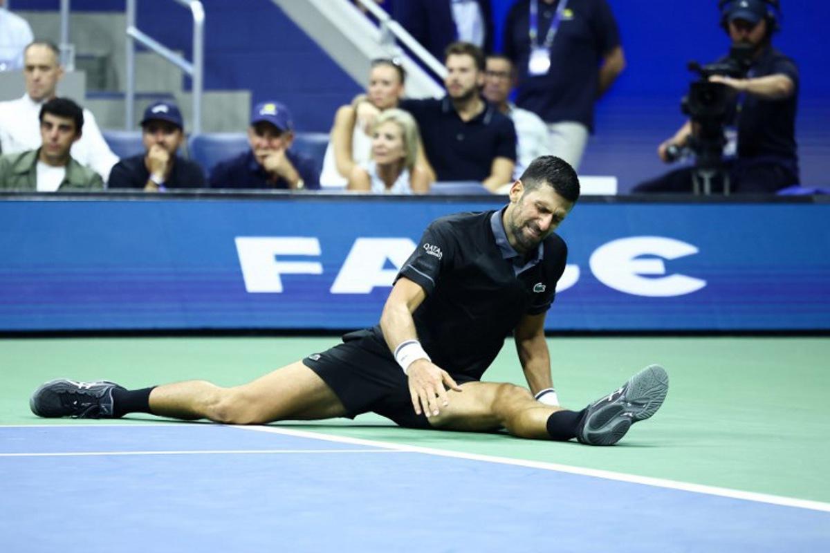 Serbia's Novak Djokovic reacts against Argentina's Mariano Navone during the men's singles first round tennis match on day one of the US Open tennis tournament at the USTA Billie Jean King National Tennis Center in New York City on August 30, 2026.  CHARLY TRIBALLEAU / AFP