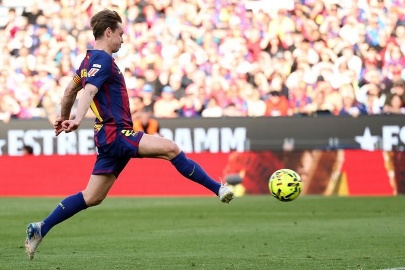 Barcelona's Dutch midfielder #21 Frenkie De Jong scores his team's second goal during the Spanish league football match between FC Barcelona and Levante UD at Camp Nou Stadium in Barcelona on February 22, 2026.  Josep LAGO / AFP