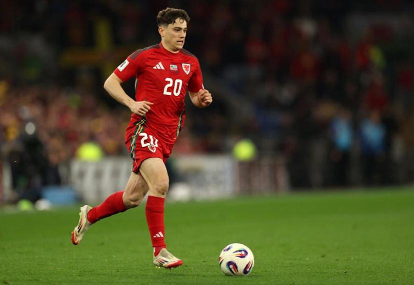 Wales' midfielder #20 Daniel James runs with the ball during the 2026 World Cup Group J qualifier football match between Wales and Kazakhstan, at Cardiff City Stadium, in Cardiff, on March 22, 2025.   Adrian Dennis / AFP