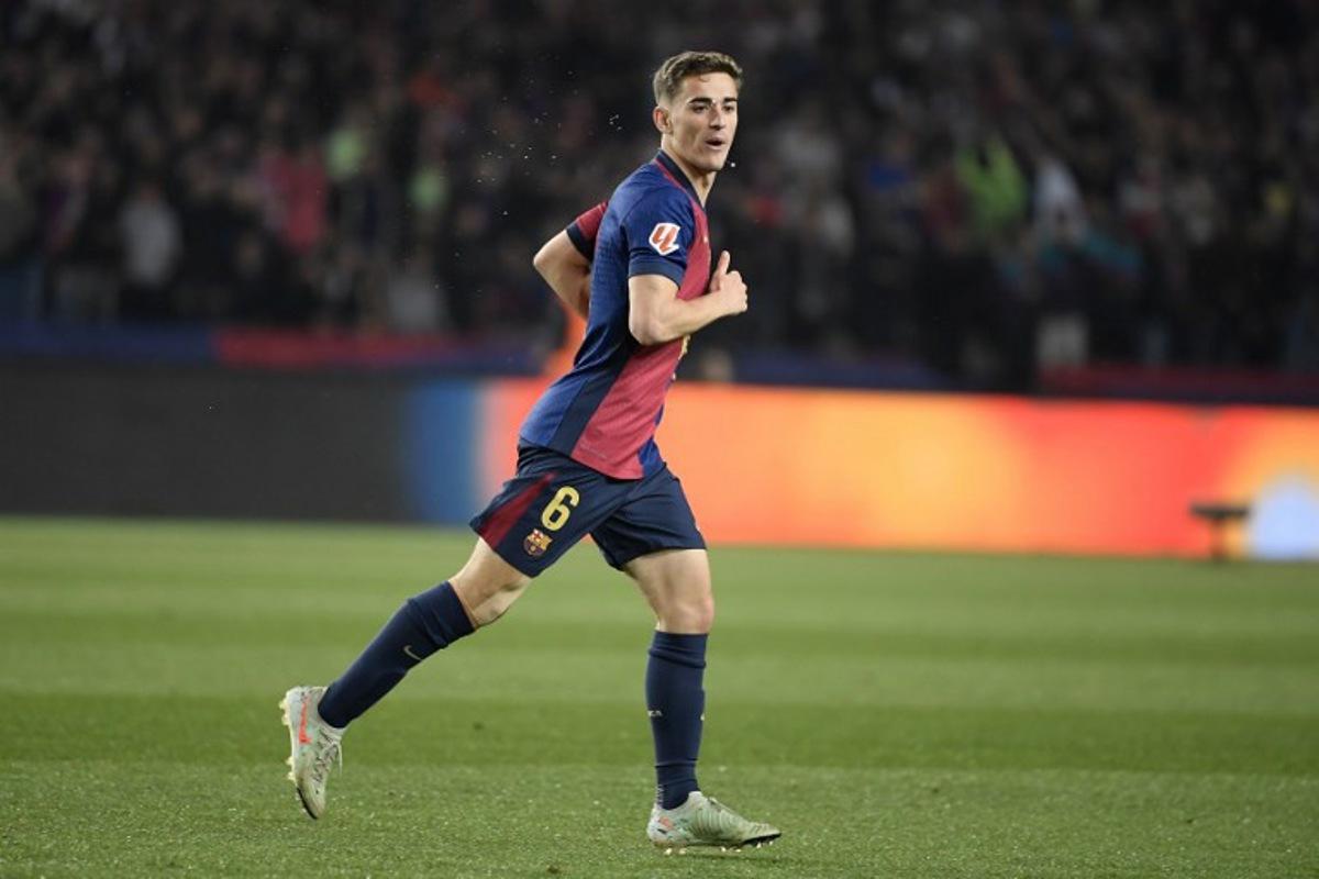 Barcelona's Spanish midfielder #06 Pablo Gavi celebrates scoring their first goal during the Spanish league football match between FC Barcelona and Real Betis at the Estadi Olimpic Lluis Companys in Barcelona, on April 5, 2025.  Josep LAGO / AFP