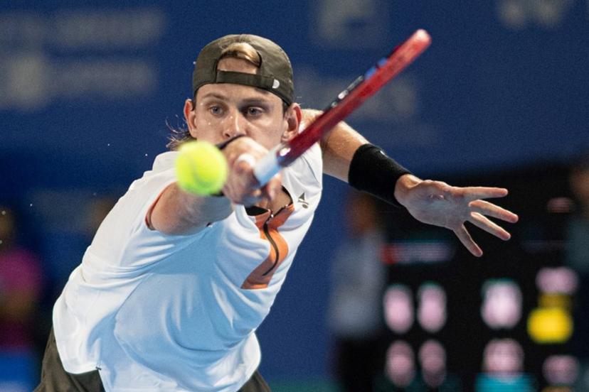 Belgium's Zizou Bergs hits a return against Spain's Carlos Alcaraz during their men's singles match at the ATP Japan Open tennis tournament in Tokyo on September 27, 2025.  Philip FONG / AFP