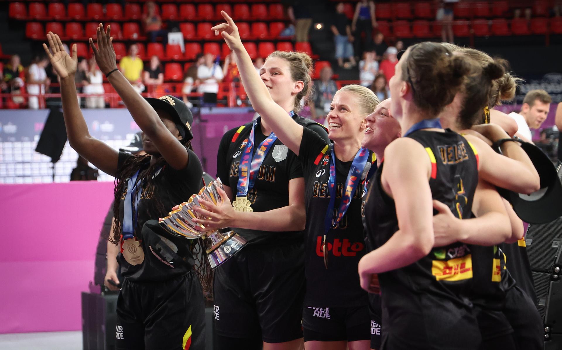 Belgian Cats' players celebrate after winning a basketball match between Spain and Belgian national team 'the Belgian Cats' on Sunday 29 June 2025 in Piraeus, Greece, the final of the FIBA Women's EuroBasket 2025. BELGA PHOTO VIRGINIE LEFOUR