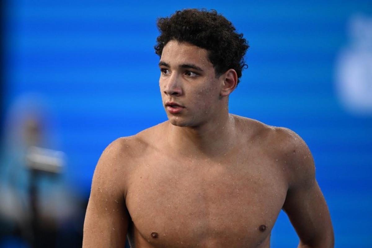 Tunisia's Ahmed Hafnaoui looks on after competing in a heat of the men's 400m freestyle swimming event during the 2024 World Aquatics Championships at Aspire Dome in Doha on February 11, 2024.  SEBASTIEN BOZON / AFP