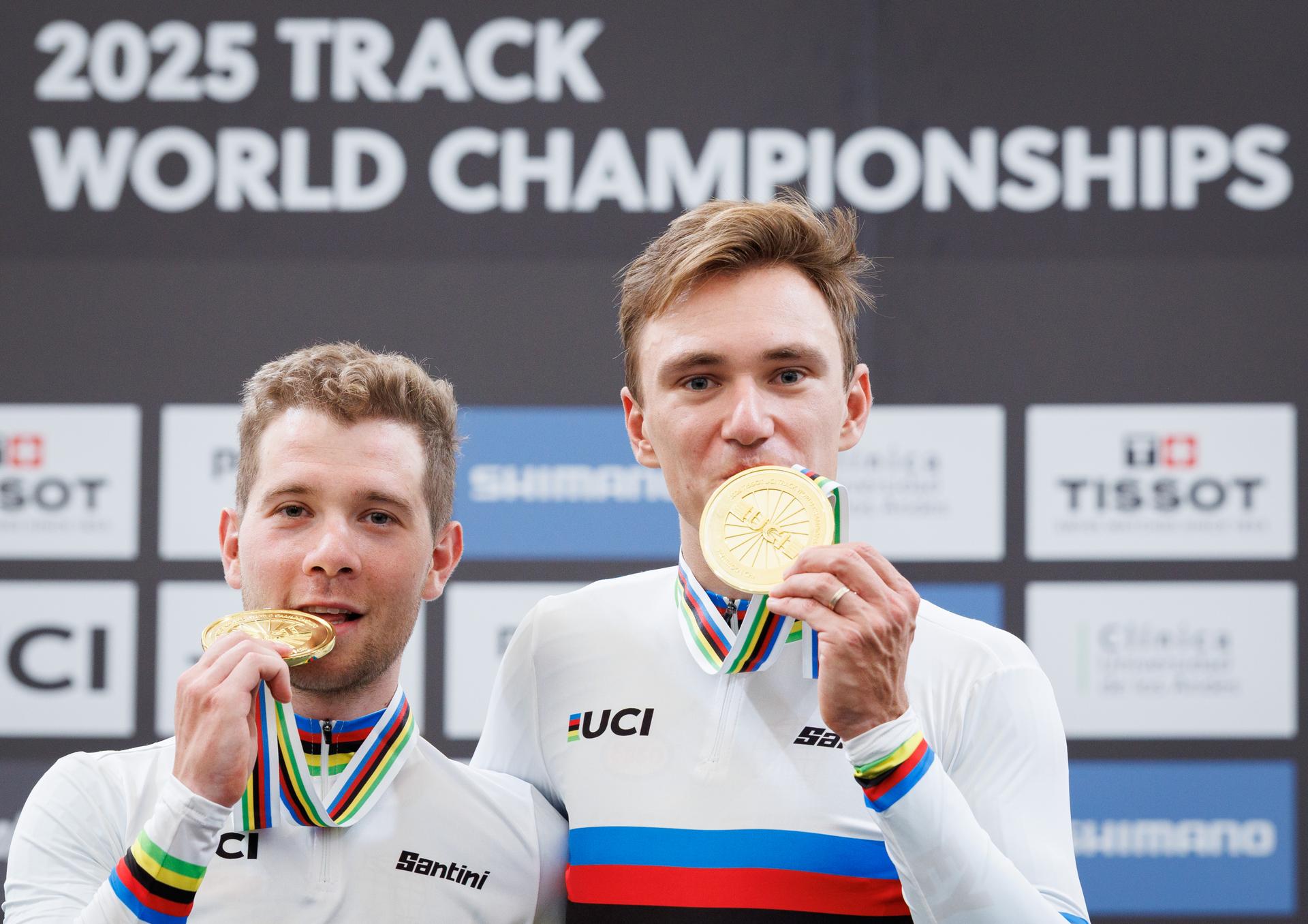 Belgian Fabio Van Den Bossche and Belgian Lindsay De Vylder celebrate on the podium after winning during the podium ceremony of the men's Madison race at the 2025 UCI Track World Championships cycling, in Santiago, Chile, Sunday 26 October 2025. The Track World Championships take place from 22 to 26 October at the Velodromo de Penalolen in Santiago, Chile. BELGA PHOTO BENOIT DOPPAGNE