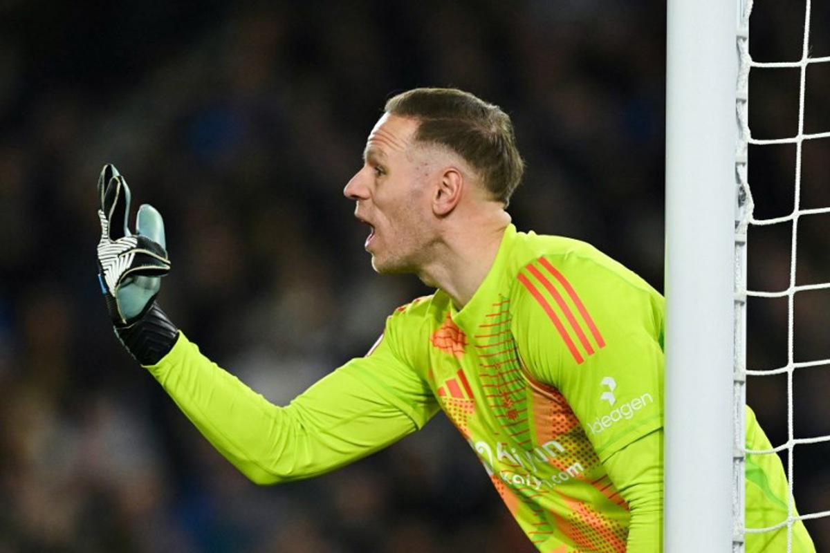 Nottingham Forest's Belgian goalkeeper #26 Matz Sels gestures during the English FA Cup quarter-final football match between Brighton & Hove Albion and Nottingham Forest at the Amex stadium, in Brighton, on March 29, 2025.  Glyn KIRK / AFP