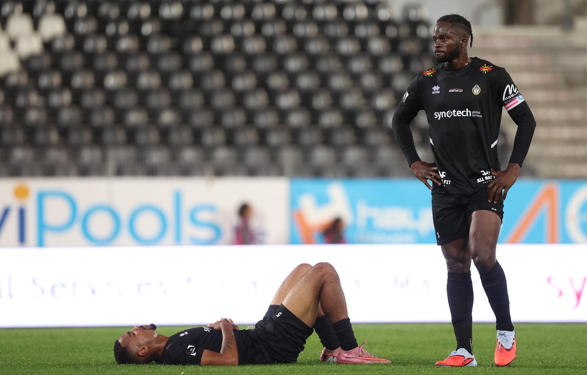 Olympic's Antonio Thea and Olympic's Junior Karl Ndedi look dejected after losing a soccer game between Royal Olympic Charleroi and KSC Lokeren, Saturday 04 October 2025 in Charleroi, on day 9 of the 2025-2026 'Challenger Pro League' 1B second division of the Belgian championship. BELGA PHOTO VIRGINIE LEFOUR