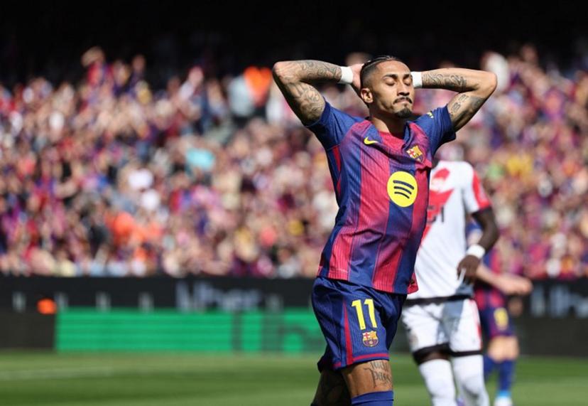 Barcelona's Brazilian forward #11 Raphinha reacts during the Spanish league football match between FC Barcelona and Rayo Vallecano de Madrid at Camp Nou Stadium in Barcelona on March 22, 2026.  Josep LAGO / AFP
