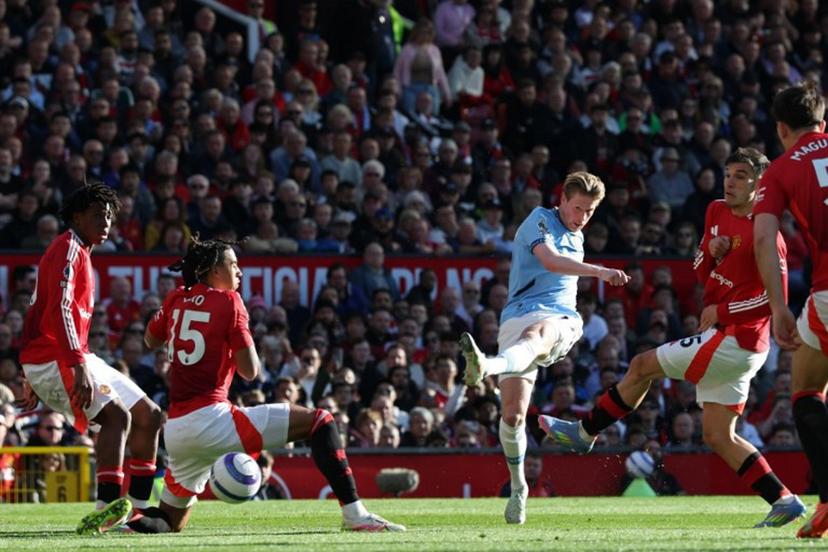 Manchester City's Belgian midfielder #17 Kevin De Bruyne shoots but fails to score during the English Premier League football match between Manchester United and Manchester City at Old Trafford in Manchester, north west England, on April 6, 2025.  Darren Staples / AFP