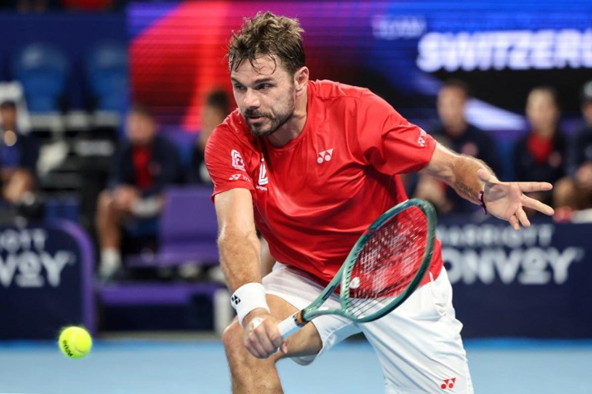 Switzerland's Stan Wawrinka hits a return to Argentina's Sebastian Baez during their men's singles match at the United Cup tennis tournament in Perth on January 7, 2026.  Antony DICKSON / AFP