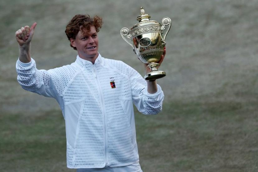 Italy's Jannik Sinner poses with his trophy after beating Germany's Alexander Zverev during their men's singles final tennis match on the fourteenth day of the 2026 Wimbledon Championships at The All England Lawn Tennis and Croquet Club in Wimbledon, southwest London, on July 12, 2026.  Adrian Dennis / AFP