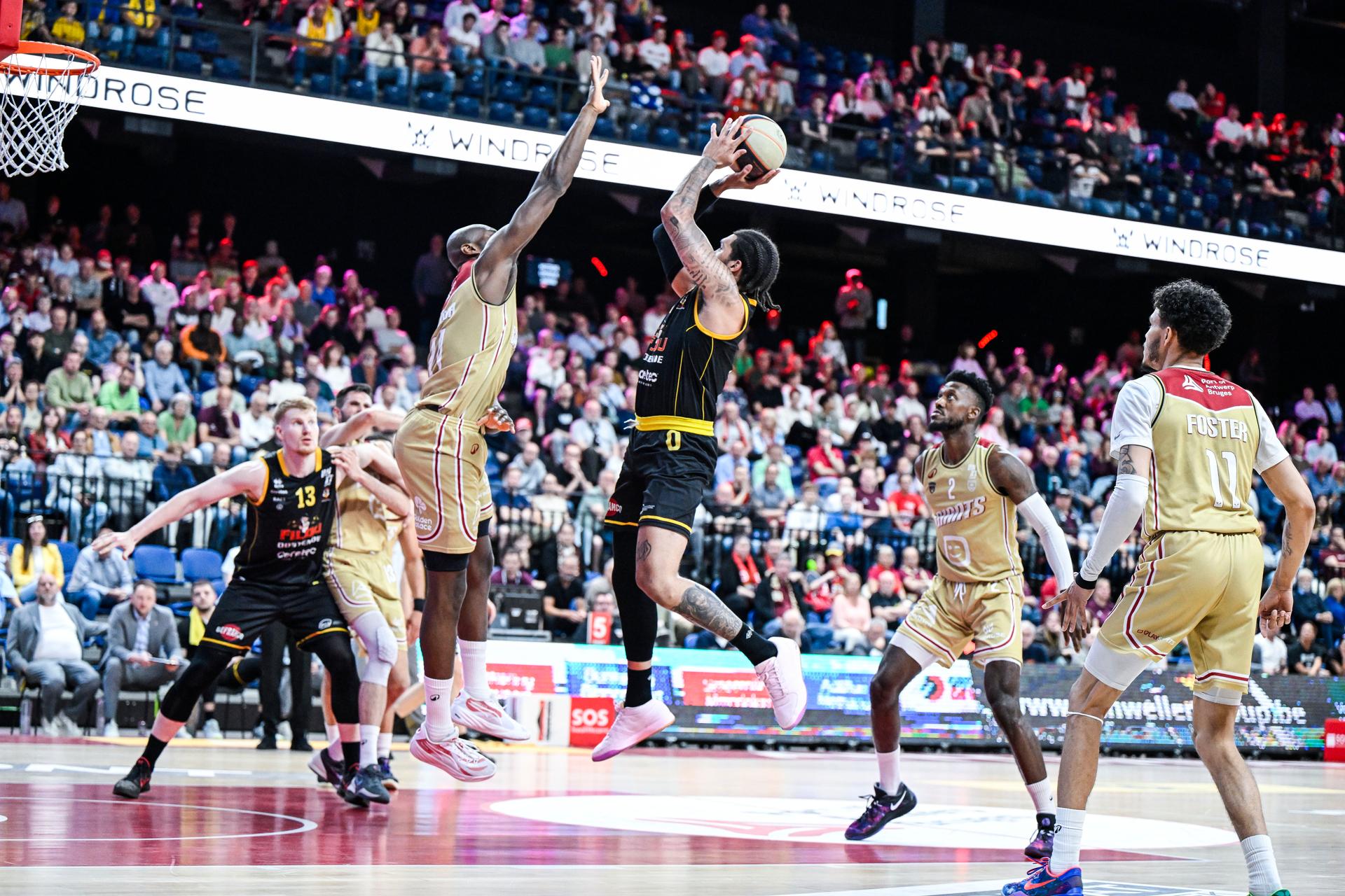 Antwerp's Kevin Tumba and Oostende's Timmy Allen pictured in action during a basketball match between Antwerp Giants and BC Oostende, Thursday 15 May 2025 in Antwerp, a quarter final game (2nd leg, best-of-3) in the playoffs of the 'BNXT League' Belgian/ Dutch first division basket championship. BELGA PHOTO TOM GOYVAERTS