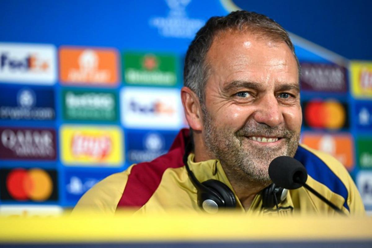 Barcelona's German coach Hansi Flick addresses a press conference, a day prior to the UEFA Champions League semi final second leg football match betweem Inter Milan and FC Barcelona, at the San Siro stadium in Milan on May 5, 2025.  Piero CRUCIATTI / AFP