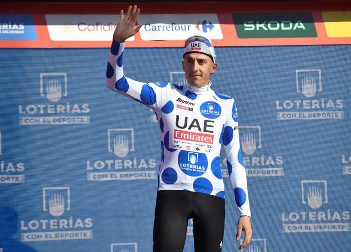 Team UAE's Marc Soler wearing the climber ranking leader celebrates on the podium after the stage 19 of the Vuelta a Espana, a 173,5 km race between Logrono and Alto de Moncalvillo, on September 6, 2024.    ANDER GILLENEA / AFP