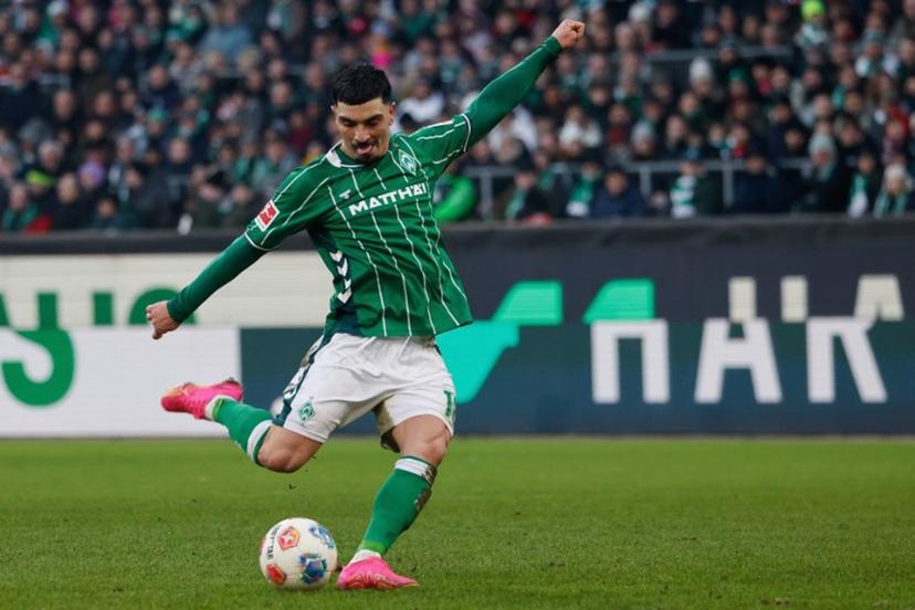 Bremen's Spanish midfielder #18 Cameron Puertas shoots during the German first division Bundesliga football match between SV Werder Bremen and FC Bayern Munich in Bremen, northern Germany February 14, 2026.   Focke Strangmann / AFP