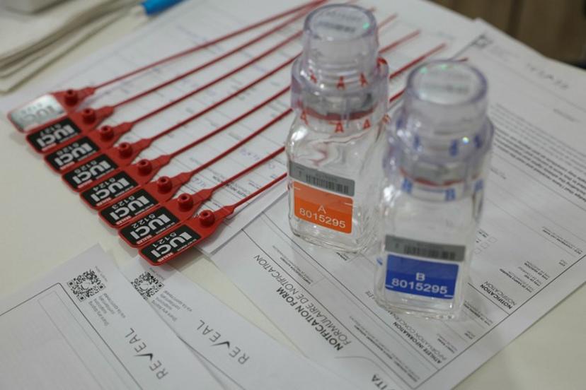 This photograph taken on July 5, 2024, shows anti-doping testing kit materials displayed at the International Testing Agency (ITA) testing facility inside a truck at the finish line of the 7th stage of the 111th edition of the Tour de France cycling race, 25,3 km individual time trial between Nuits-Saint-Georges and Gevrey-Chambertin. The overall leader yellow jersey rider and stage winner are systematically summoned to be tested for doping after the day's stage, along with any rider selected by ITA based on performance or intelligence from the organisation's investigative department. A chaperon escorts the rider to the facility where a supervised urine sample is collected for testing. Thomas SAMSON / AFP
