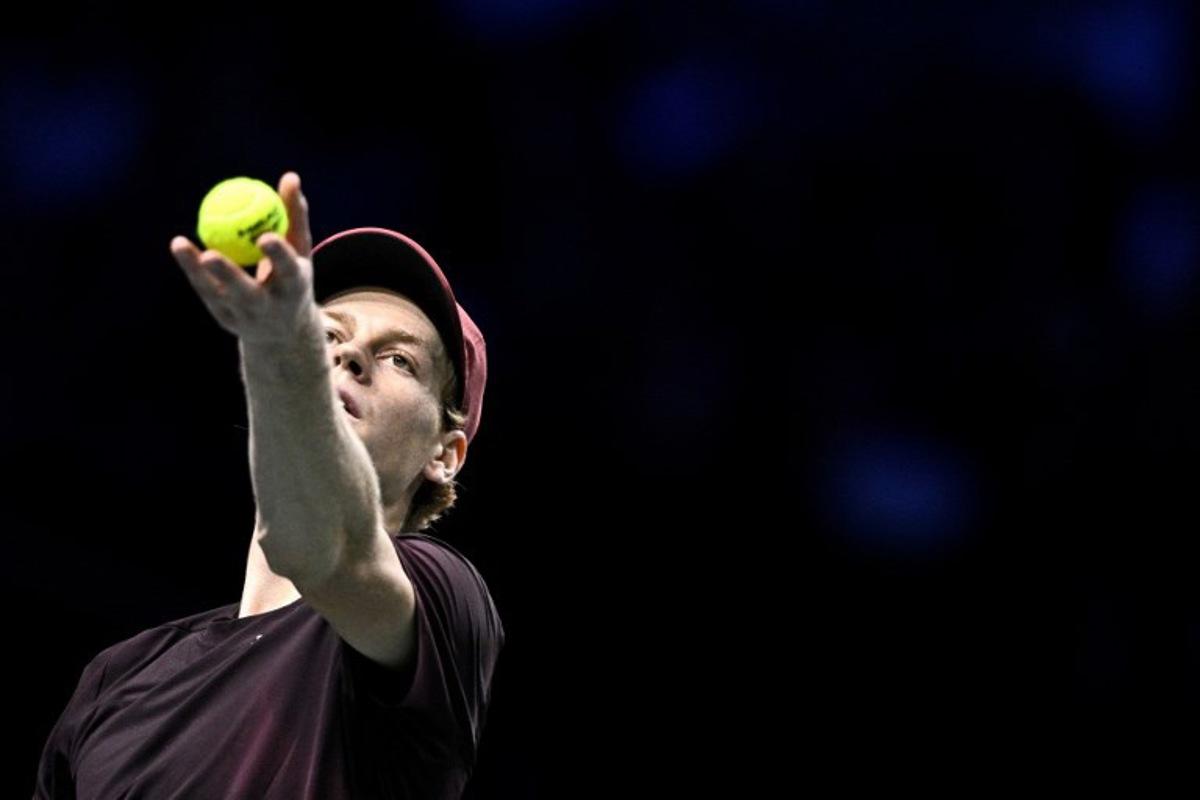 Italy's Jannik Sinner serves to US Ben Shelton during their men's singles quarter-final match on day five of the Paris ATP Masters 1000 tennis tournament at the Paris La Défense Arena in Nanterre, on the outskirts of Paris, on October 31, 2025.  JULIEN DE ROSA / AFP