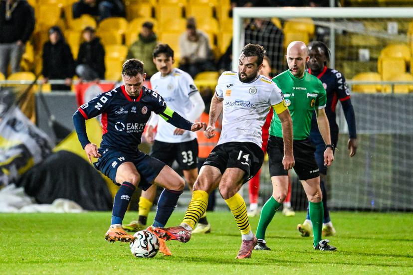 Kortrijk's Brecht Dejaegere and Lokeren's Toon Janssen pictured in action during a soccer game between KSC Lokeren and KV Kortrijk, Saturday 29 November 2025 in Lokeren, on day 15 of the 2025-2026 'Challenger Pro League' 1B second division of the Belgian championship. BELGA PHOTO TOM GOYVAERTS