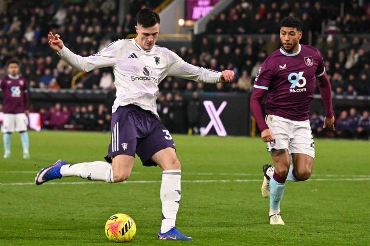 Manchester United's Slovenian striker #30 Benjamin Sesko (L) hammers the ball into the far corner to score their first goal to equalise 1-1 during the English Premier League football match between Burnley and Manchester United at Turf Moor in Burnley, north-west England on January 7, 2026.  Oli SCARFF / AFP