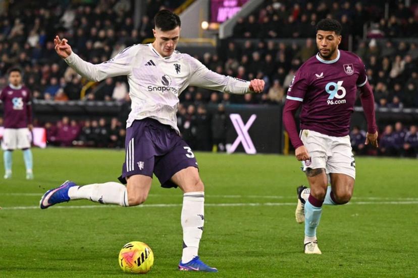 Manchester United's Slovenian striker #30 Benjamin Sesko (L) hammers the ball into the far corner to score their first goal to equalise 1-1 during the English Premier League football match between Burnley and Manchester United at Turf Moor in Burnley, north-west England on January 7, 2026.  Oli SCARFF / AFP