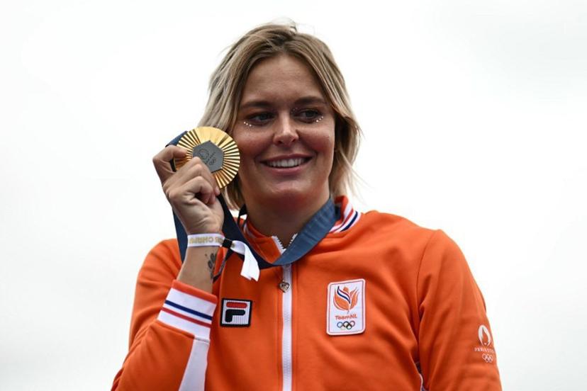 Netherlands' Sharon Van Rouwendaal, women's 10km marathon swimming gold medalist, celebrates on stage at the Champions Park at Trocadero during the Paris 2024 Olympic Games in Paris on August 9, 2024.  CARL DE SOUZA / AFP
