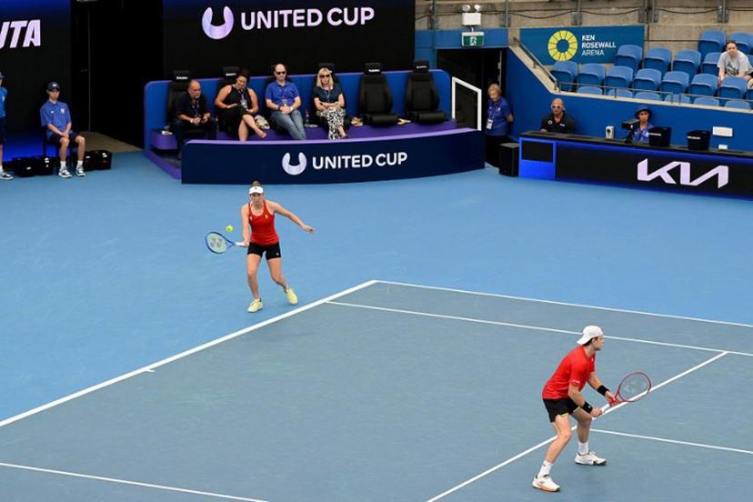 Belgium's Elise Mertens (L) and Zizou Bergs hit a return to Canada's Cleeve Harper and Victoria Mboko during their mixed doubles match at the United Cup tennis tournament on Ken Rosewall Arena, Sydney on January 6, 2026.  Izhar KHAN / AFP