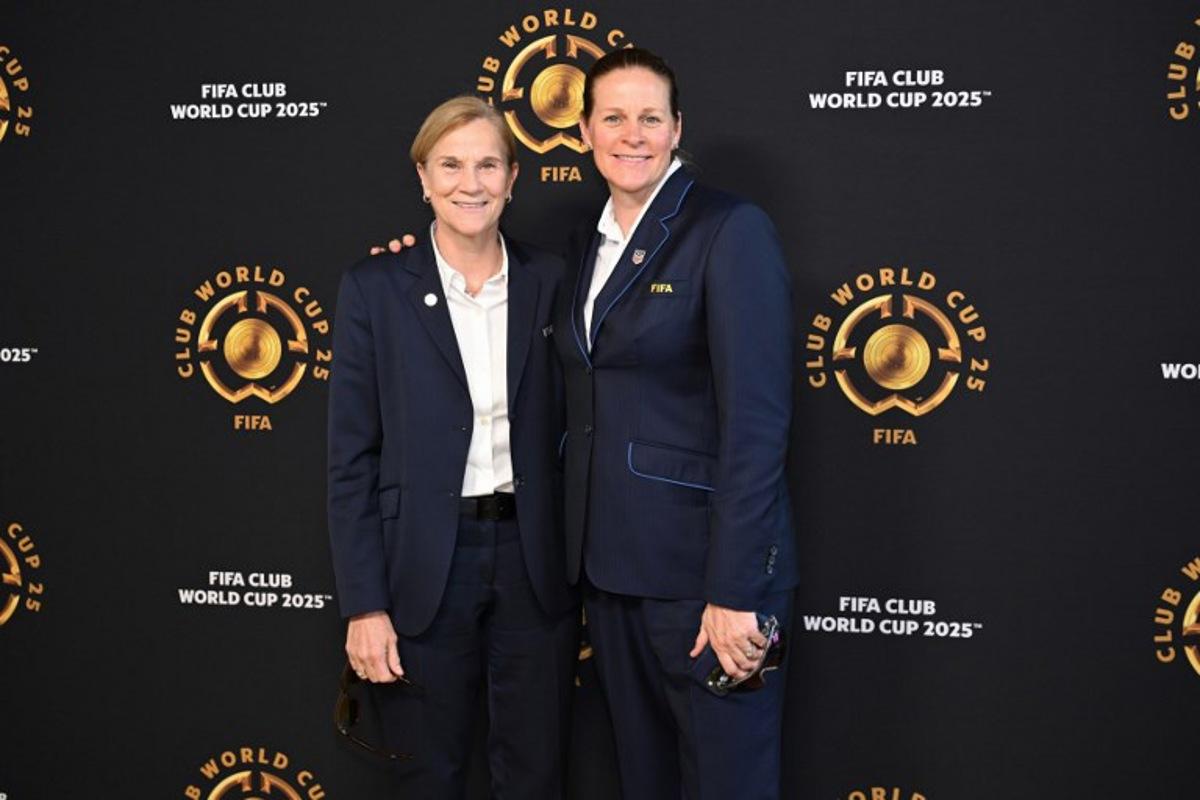 FIFA Chief Football Officer Jill Ellis (L) and President of the United States Soccer Federation Cindy Parlow Cone pose on the Golden Carpet upon arrival for the FIFA Club World Cup 2025 final football match between England's Chelsea and France's Paris Saint-Germain at the MetLife Stadium in East Rutherford, New Jersey on July 13, 2025.  ANGELA WEISS / AFP