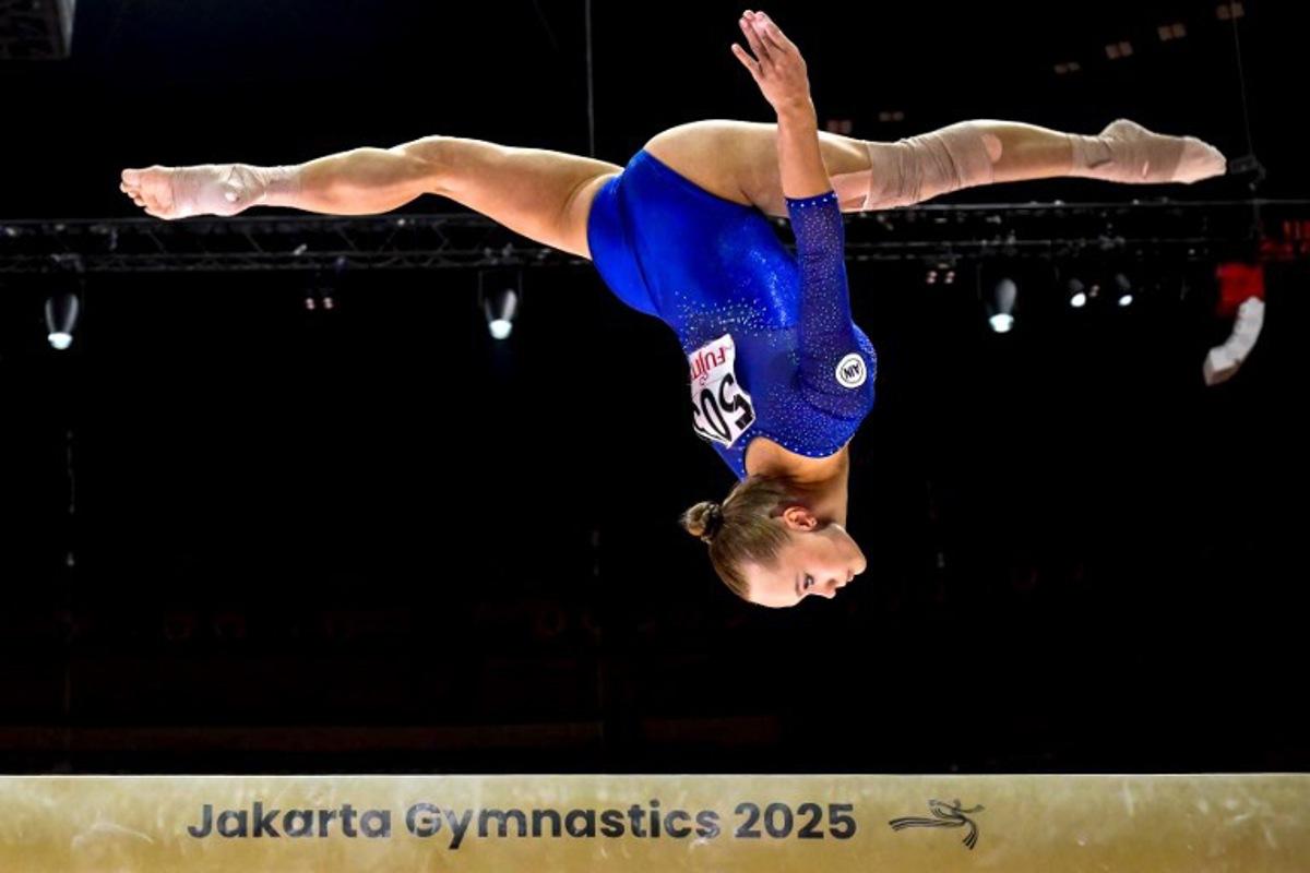 Russia's Angelina Melnikova competes as Individual Neutral Athletes on the uneven bars during the women's qualifying session at the 53rd FIG Artistic Gymnastics World Championships in Jakarta on October 21, 2025.   BAY ISMOYO / AFP