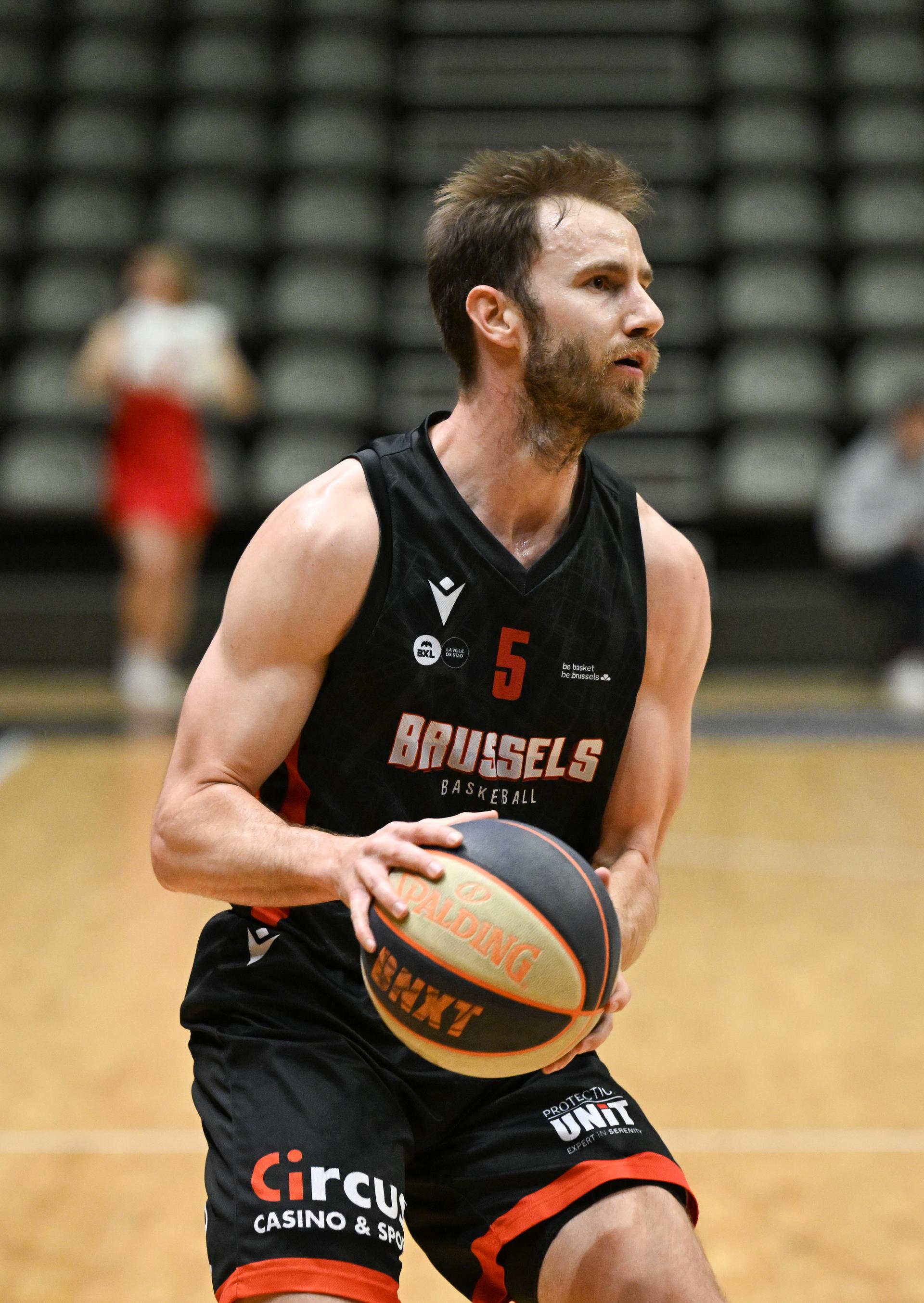 Brussels' Alexandre Libert controls the ball during a basketball match between Leuven Bears and Brussels Basketball, Friday 08 March 2024 in Leuven, on day 1 in the elite Silver, cross-boarder phase of the 'BNXT League' Belgian and Netherlands first division basket championship. BELGA PHOTO JOHN THYS