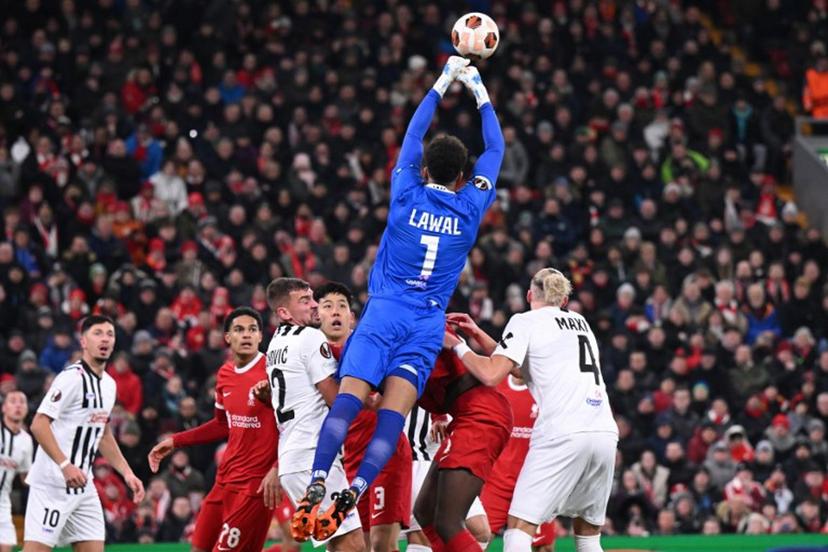 Linz's Austrian goalkeeper #01 Tobias Lawal punches the ball clear during the UEFA Europa League group E football match between Liverpool and Linzer ASK at Anfield in Liverpool, north west England on November 30, 2023.  Oli SCARFF / AFP