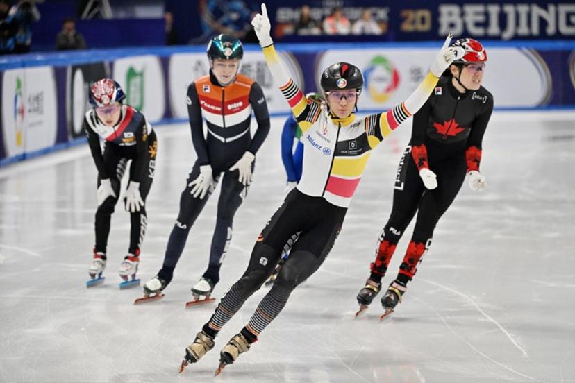 Belgium's Hanne Desmet (C) celebrates her victory in the women's 1000 meters final at the ISU World Short Track Championships in Beijing on March 15, 2025.  ADEK BERRY / AFP