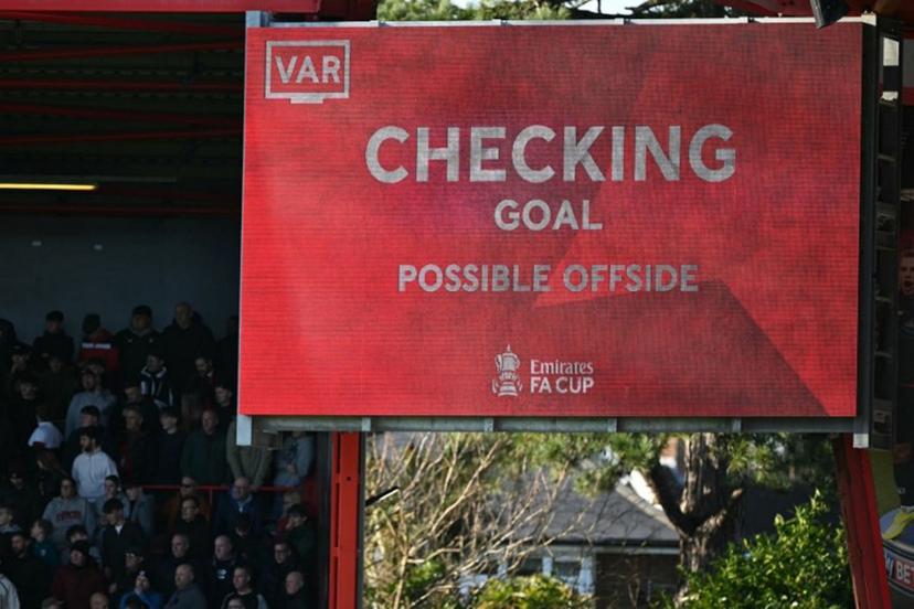 The big screen displays the news that a VAR (Video Assistant Referee) review is ongoing after Bournemouth's second goal, later disallowed for offside during the English FA Cup fifth round football match between AFC Bournemouth and Wolverhampton Wanderers at the Vitality Stadium in London on March 1, 2025.  JUSTIN TALLIS / AFP