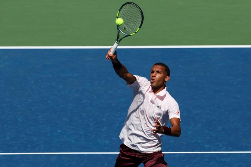 Canada's Felix Auger-Aliassime hits a return to Russia's Karen Khachanov during their men's singles second round tennis match on day five of the US Open tennis tournament at the USTA Billie Jean King National Tennis Center in New York City on September 3, 2026.  TIMOTHY A. CLARY / AFP