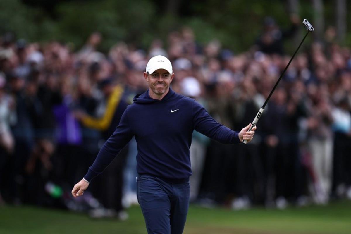 Northern Ireland's Rory McIlroy reacts after sinking his putt on the 18th on the fourth day of the BMW PGA Championship at Wentworth Golf Club, south-west of London, on September 14, 2025.  HENRY NICHOLLS / AFP