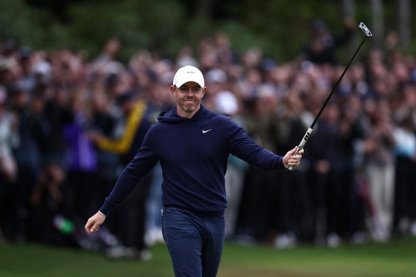 Northern Ireland's Rory McIlroy reacts after sinking his putt on the 18th on the fourth day of the BMW PGA Championship at Wentworth Golf Club, south-west of London, on September 14, 2025.  HENRY NICHOLLS / AFP
